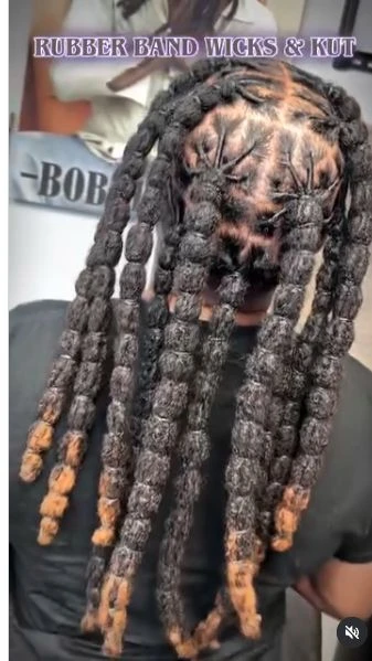 Knotted loc style with clean geometric parts.