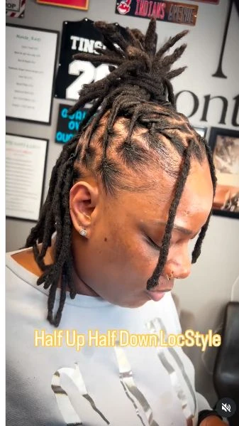 Half-up loc style with a fresh retwist.