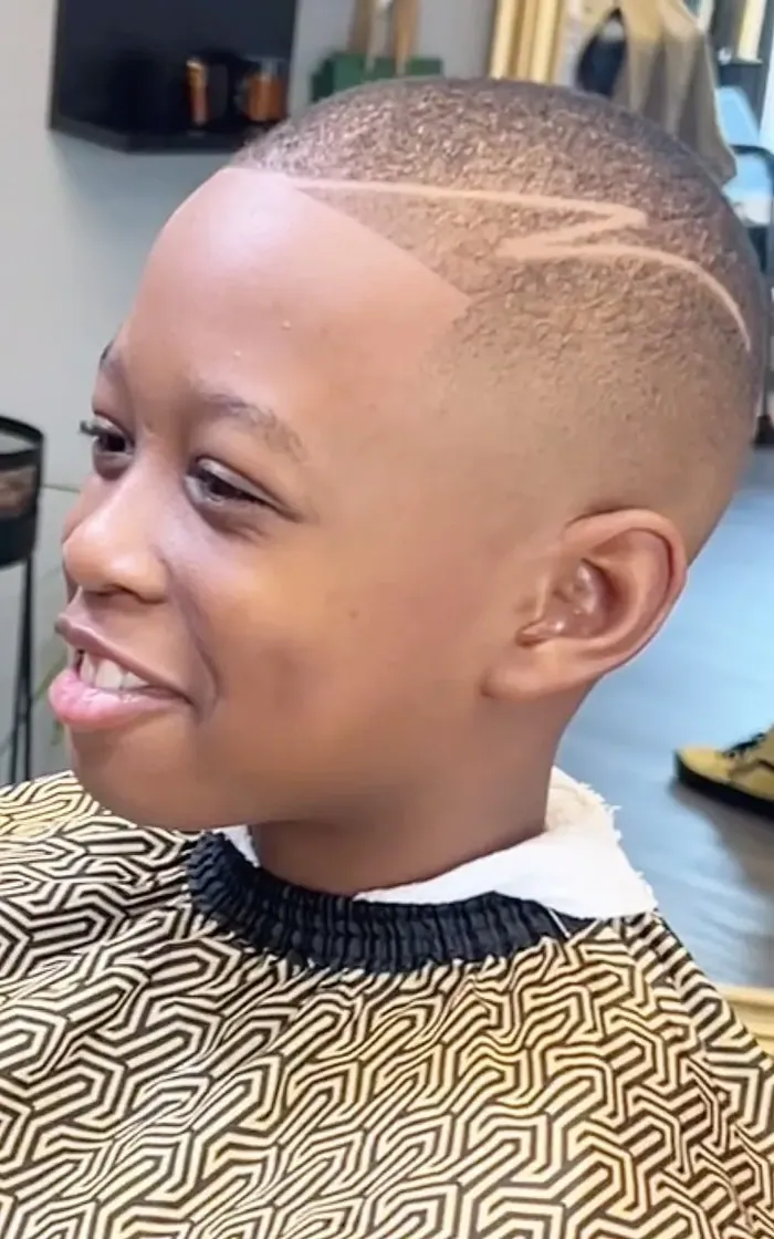 A shaved lightning-bolt design set into a high skin fade.